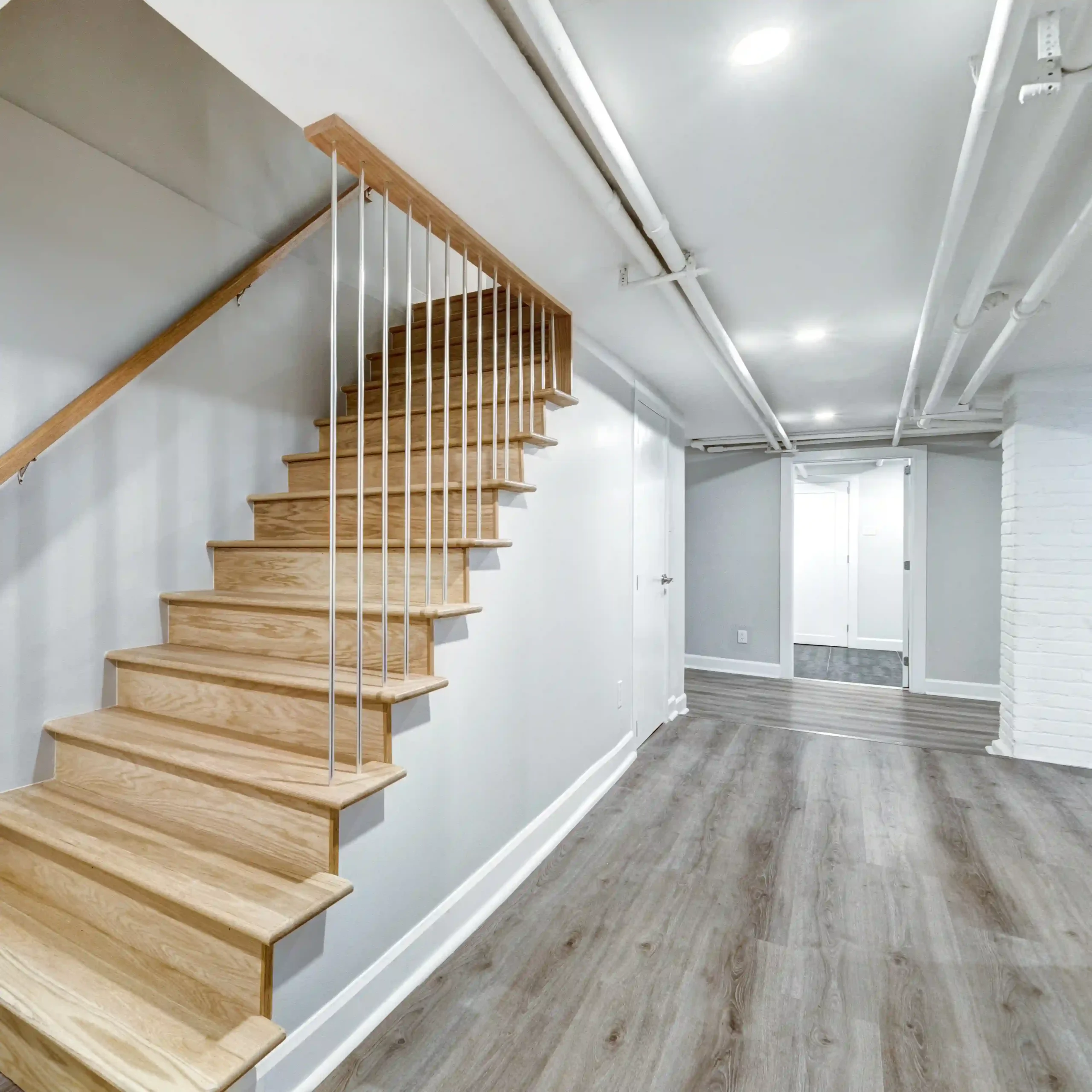 Finished basement remodel with staircase and updated flooring